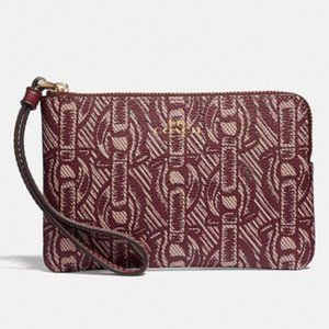 Coach red wristlet corner zip with chain print